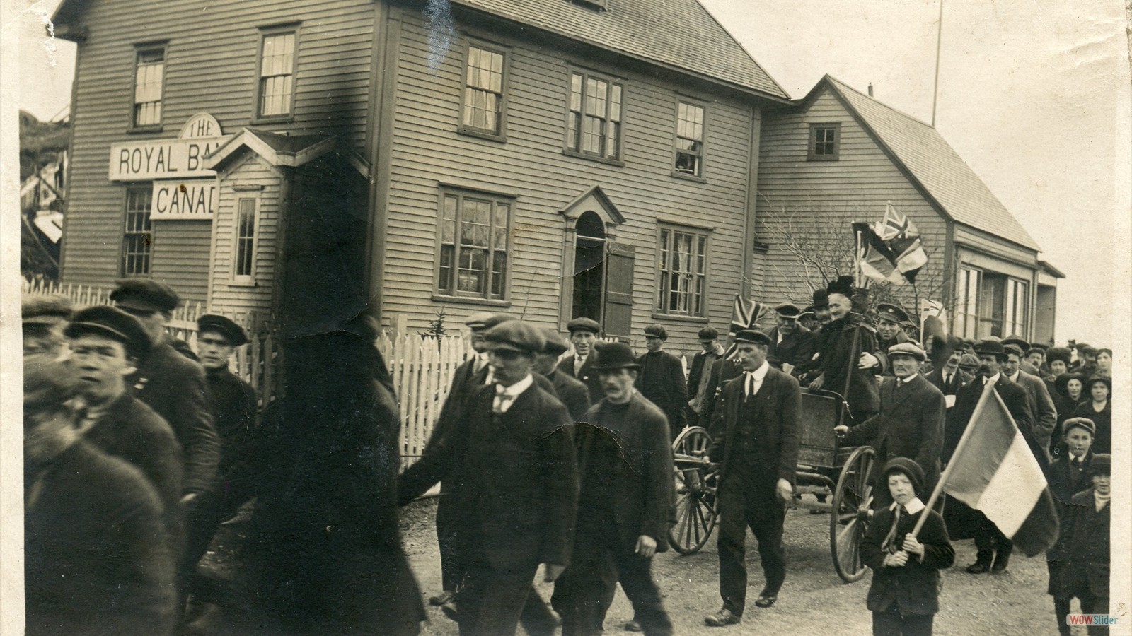 Parade to Welcome Home William George Tibbs from the First World War, notice in this picture the Royal Bank that was at the Hiscock House, it opened in 1911